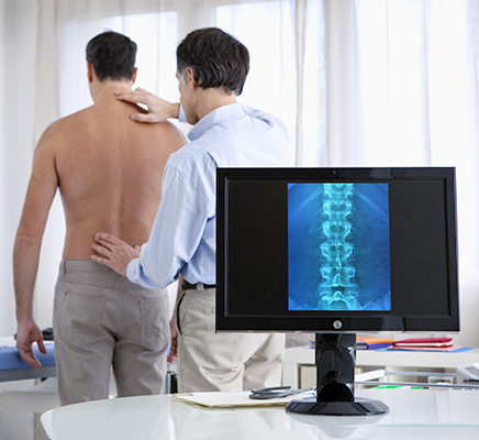 Doctor examining patient spine